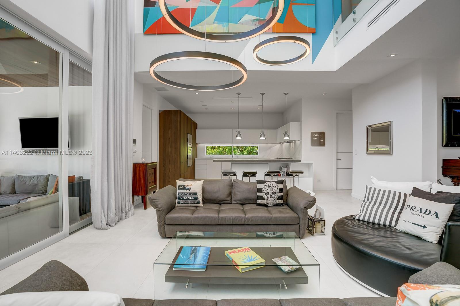 141 Harbor Drive Key Biscayne, FL 33149 - Photo 16 of 56 a living room with furniture and a flat screen tv