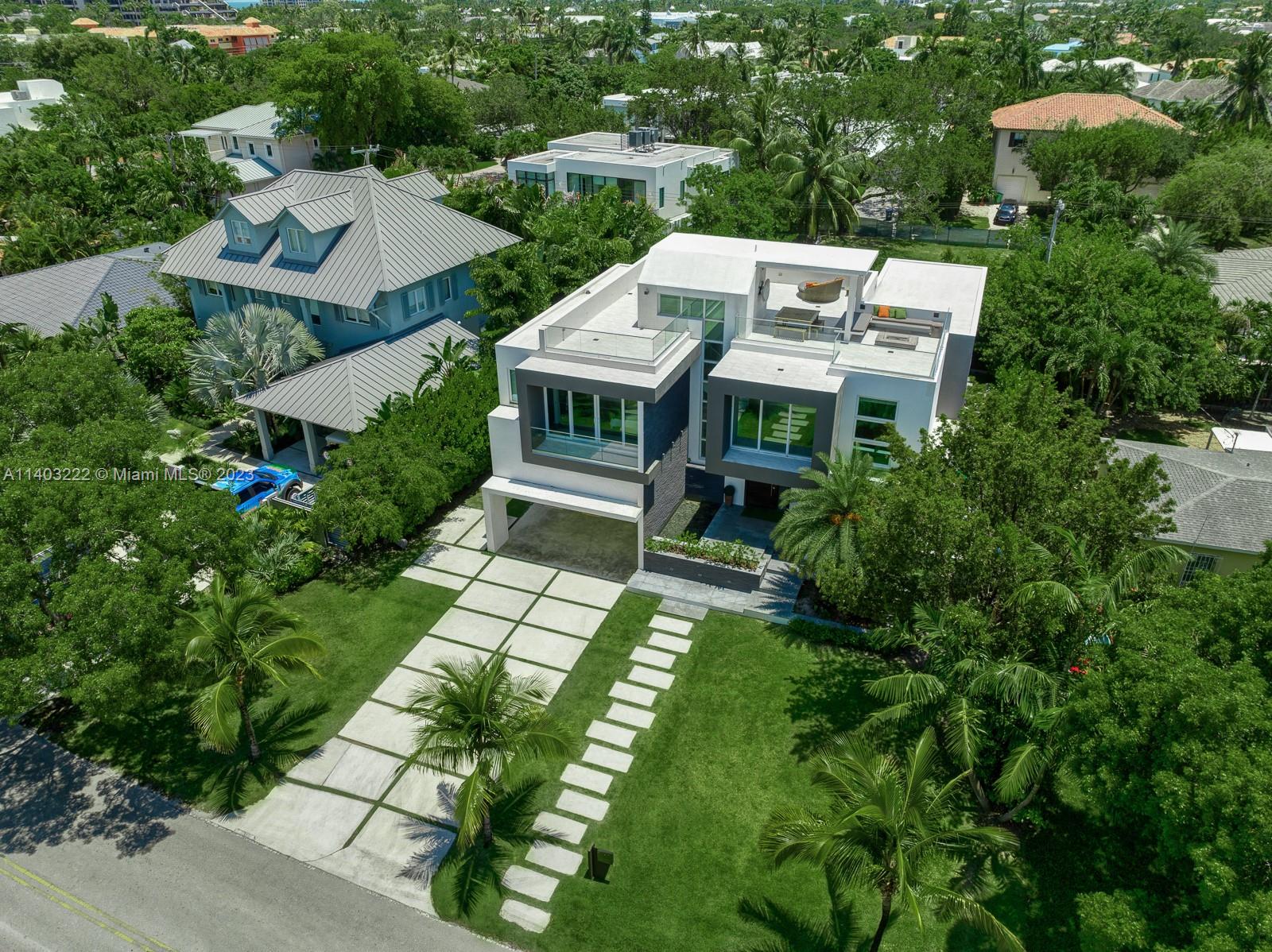 141 Harbor Drive Key Biscayne, FL 33149 - Photo 3 of 56 an aerial view of house with yard
