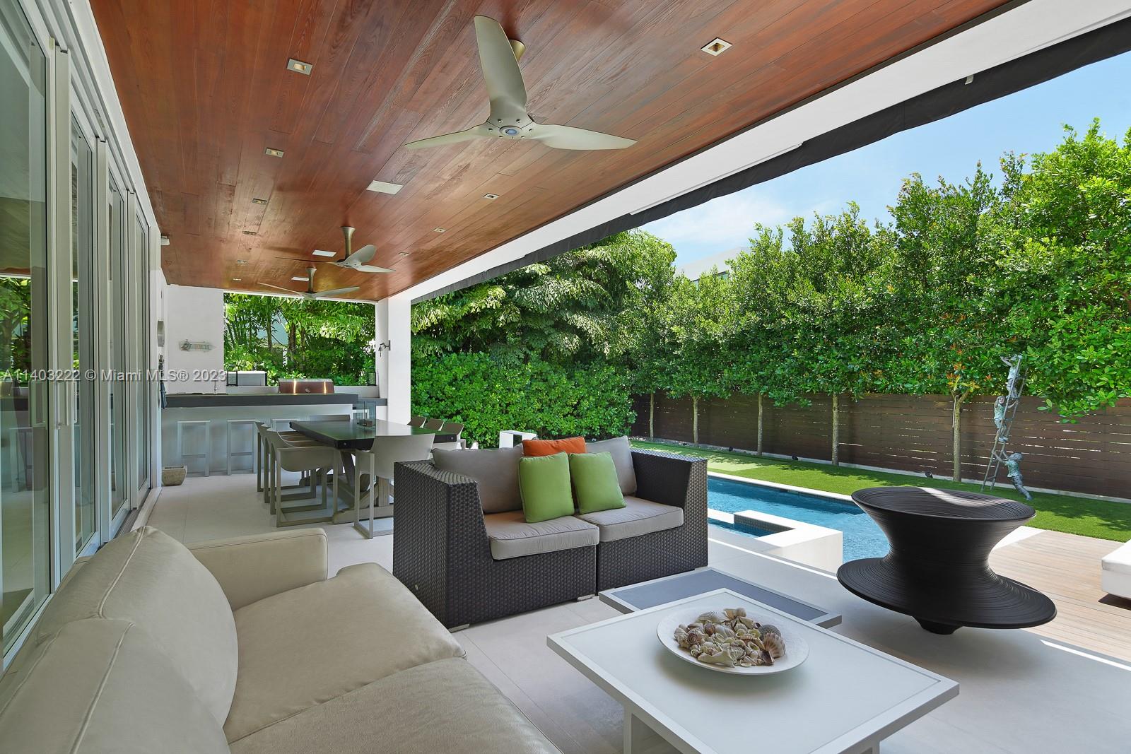 141 Harbor Drive Key Biscayne, FL 33149 - Photo 51 of 56 a patio with patio a couch and chairs