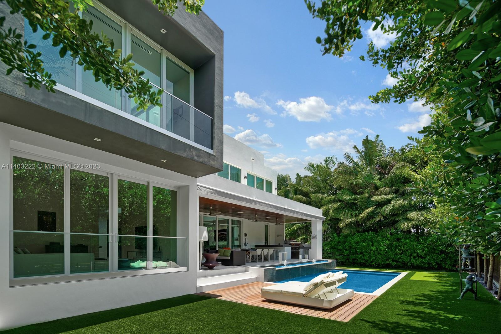 141 Harbor Drive Key Biscayne, FL 33149 - Photo 53 of 56 a view of a house with backyard porch and sitting area