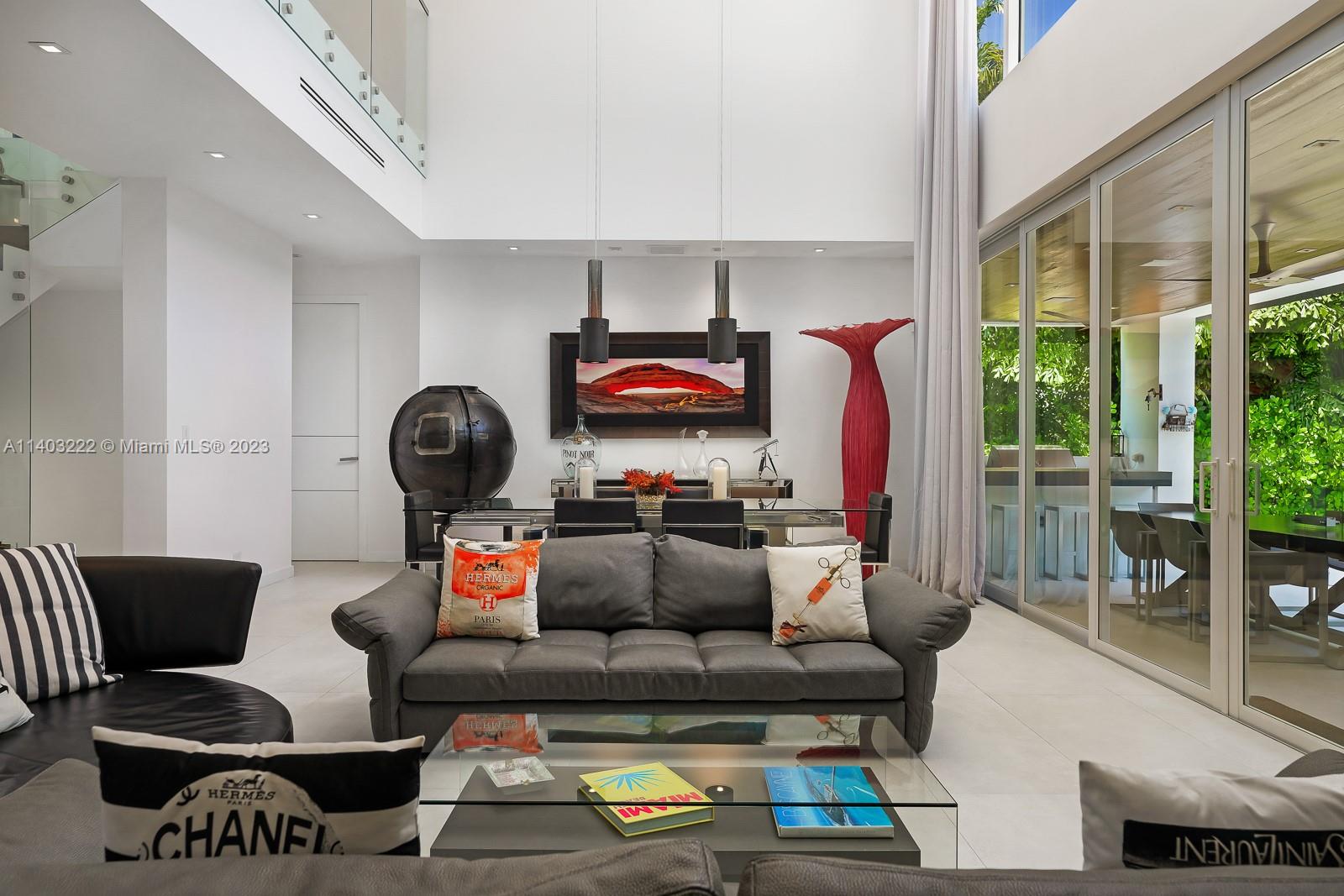 141 Harbor Drive Key Biscayne, FL 33149 - Photo 9 of 56 a living room with furniture and a lamp