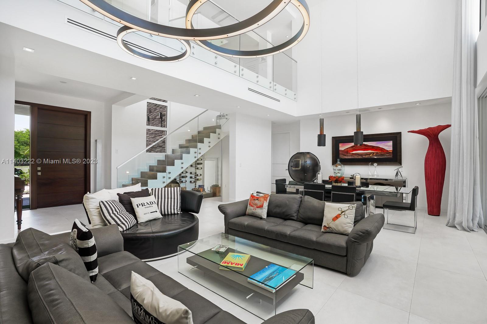 141 Harbor Drive Key Biscayne, FL 33149 - Photo 10 of 56 a living room with furniture and a flat screen tv