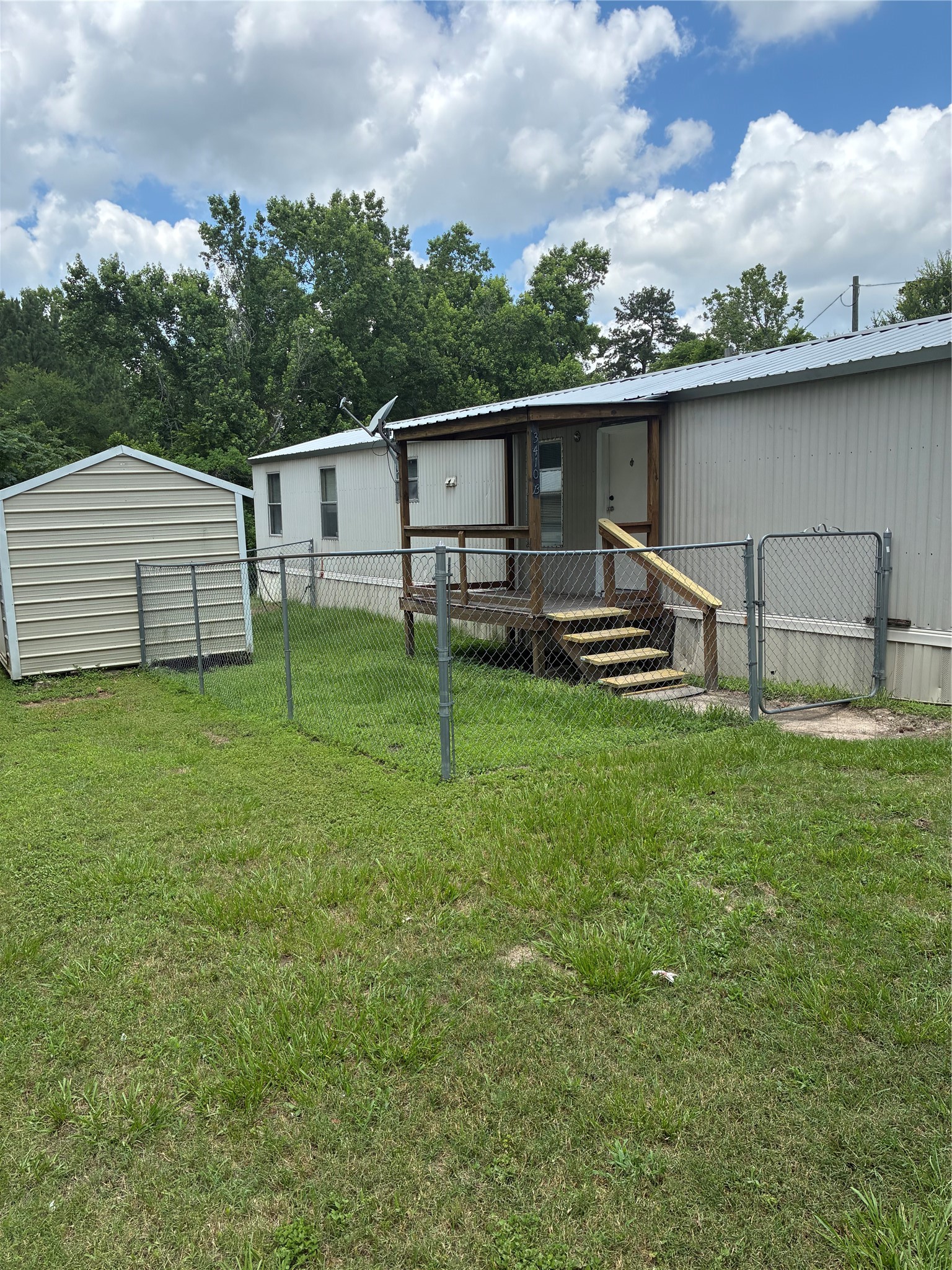 3410 Old Houston Road, Unit B Huntsville, TX 77340 - Photo 2 of 7 a backyard of a house with table and chairs