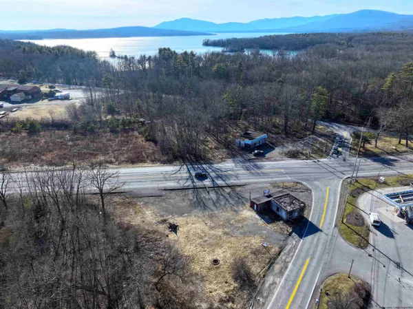 a view of a backyard with swimming pool