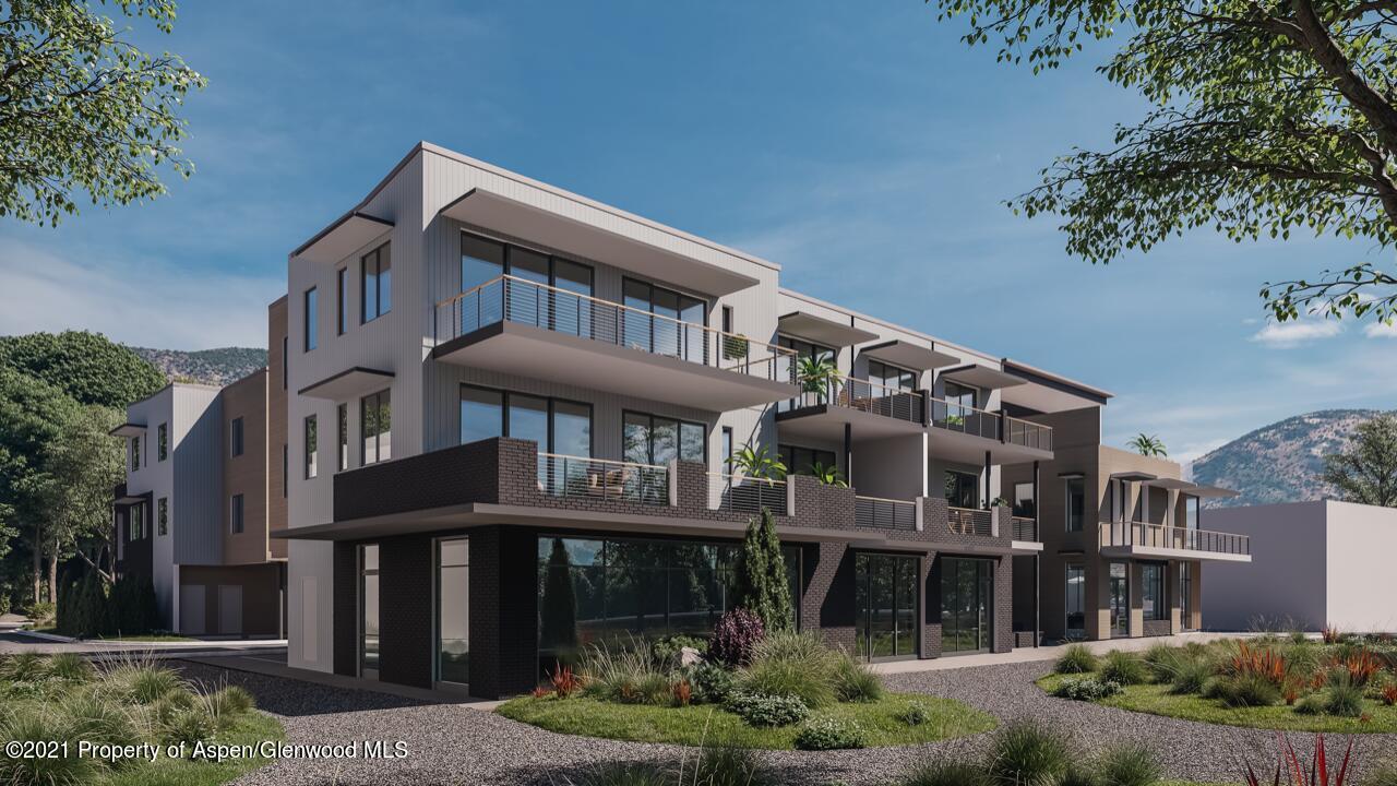 22860 2 Rivers Road, Unit THE RIVER LOFTS 372 Basalt, CO 81621 - Photo 1 of 7 a front view of a house with a garden