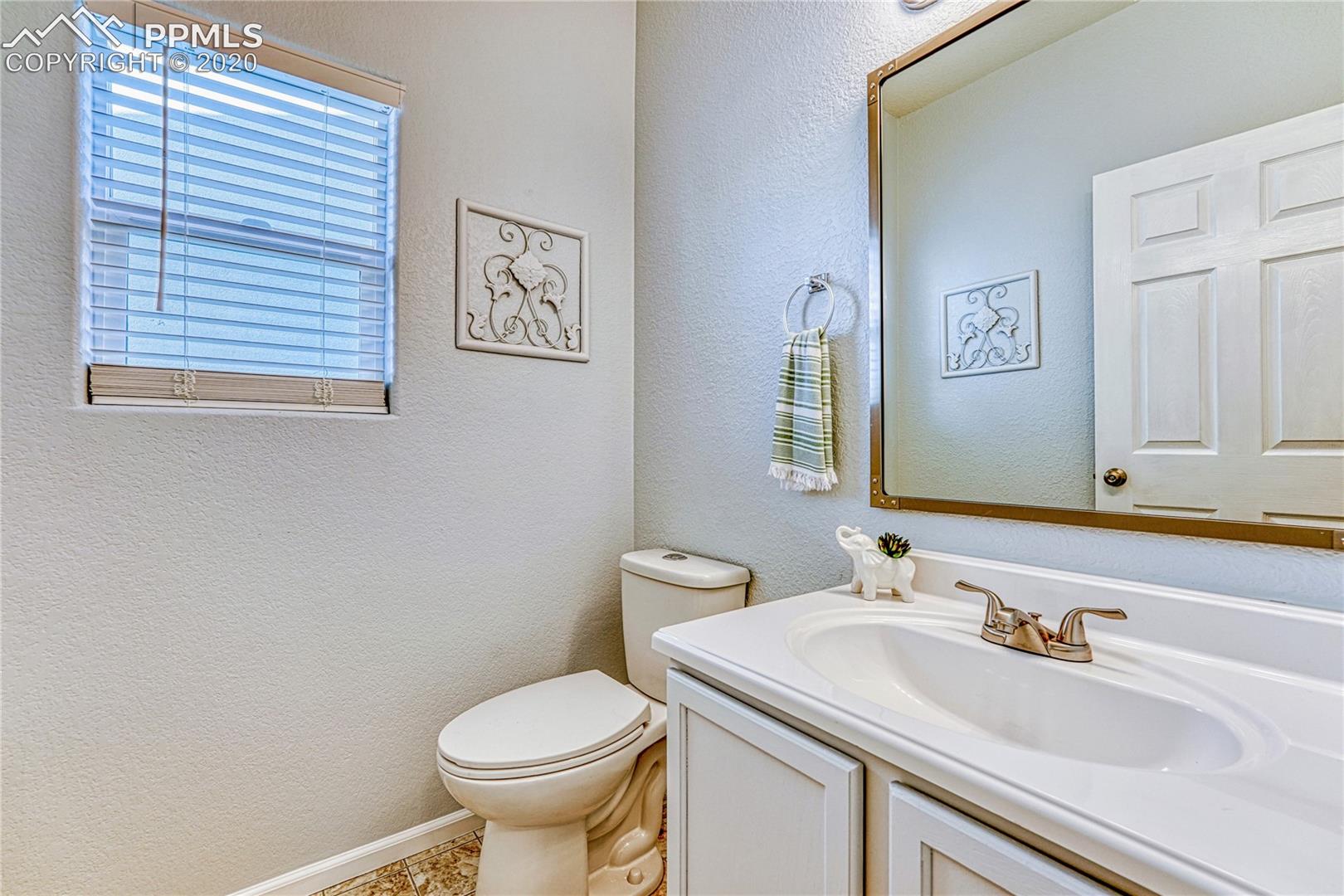 6554 Hannah Rose Road Colorado Springs, CO 80923 - Photo 16 of 29 Newly painted half bath on lower level.