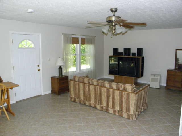 181 East Biggs Road Portland, TN 37148 - Photo 11 of 20 a living room with furniture and a chandelier