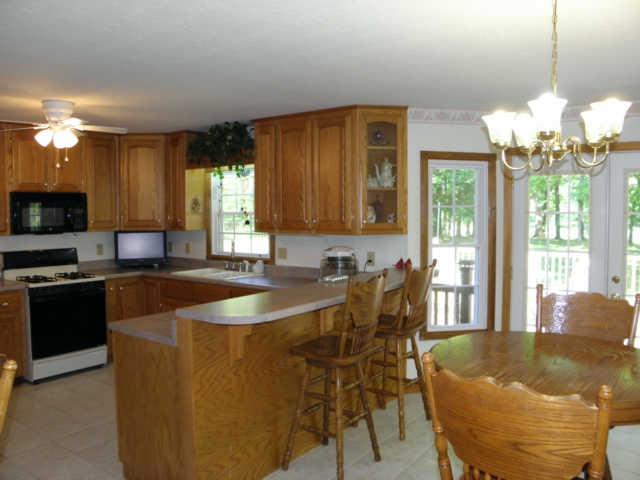 181 East Biggs Road Portland, TN 37148 - Photo 5 of 20 a dining table with chairs and a chandelier