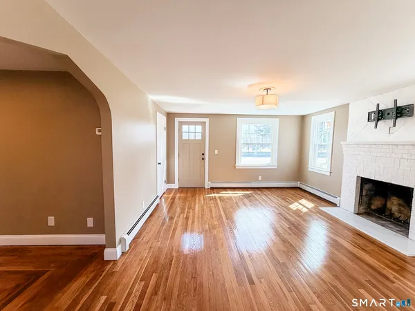 a kitchen with stainless steel appliances granite countertop a sink a stove top oven and cabinetry