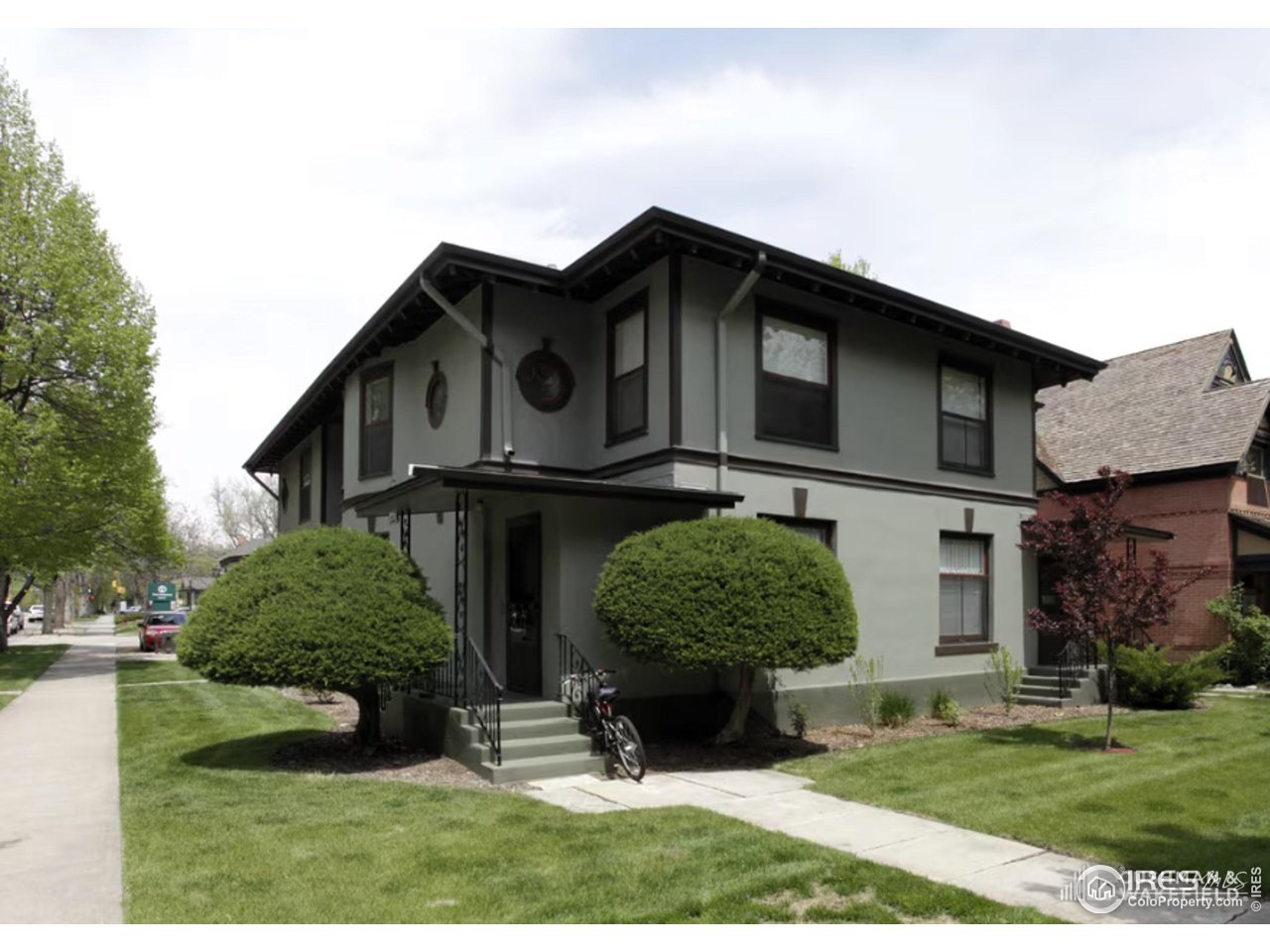 324 South Howes Street Fort Collins, CO 80521 - Photo 2 of 2 a front view of a house with a garden and plants