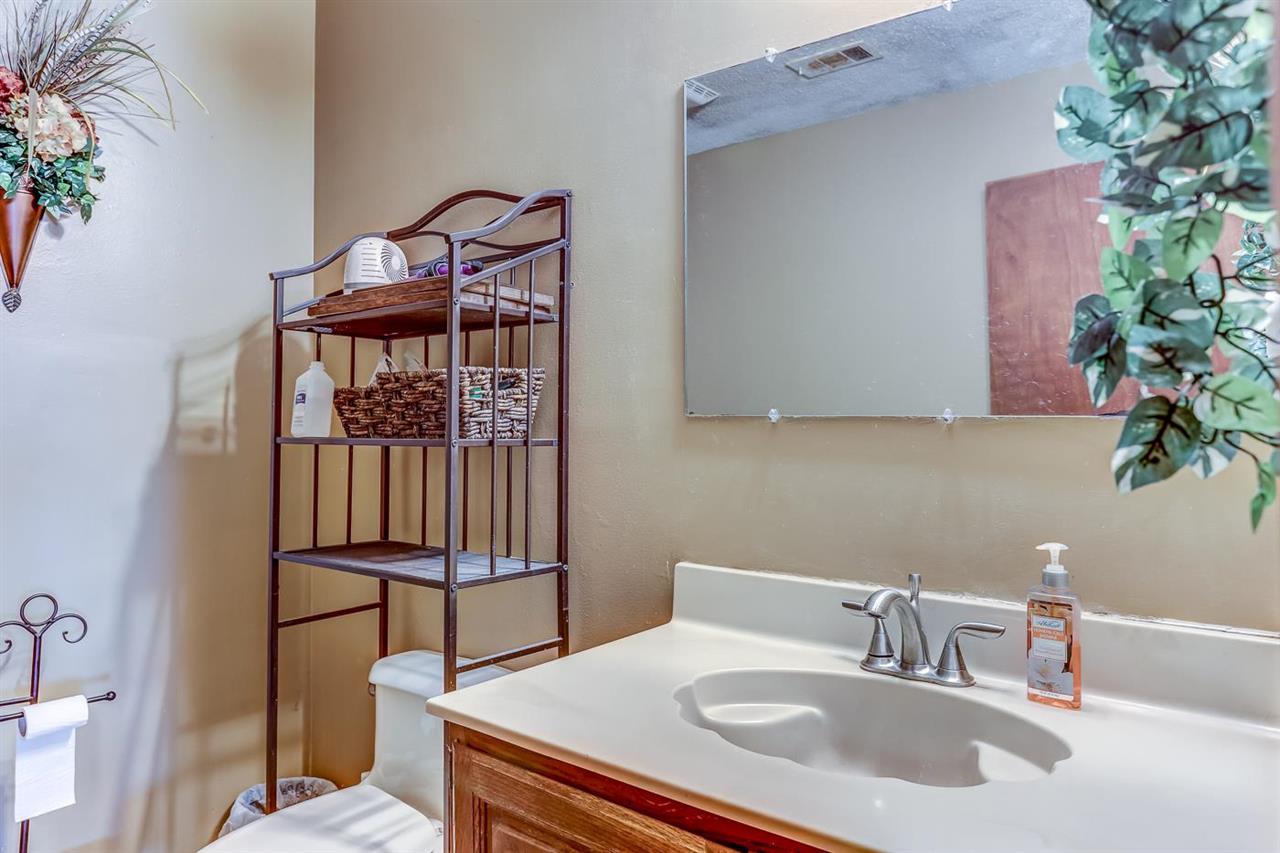 10 Windsor Road Memphis, TN 38109 - Photo 12 of 25 a bathroom with a sink and a mirror