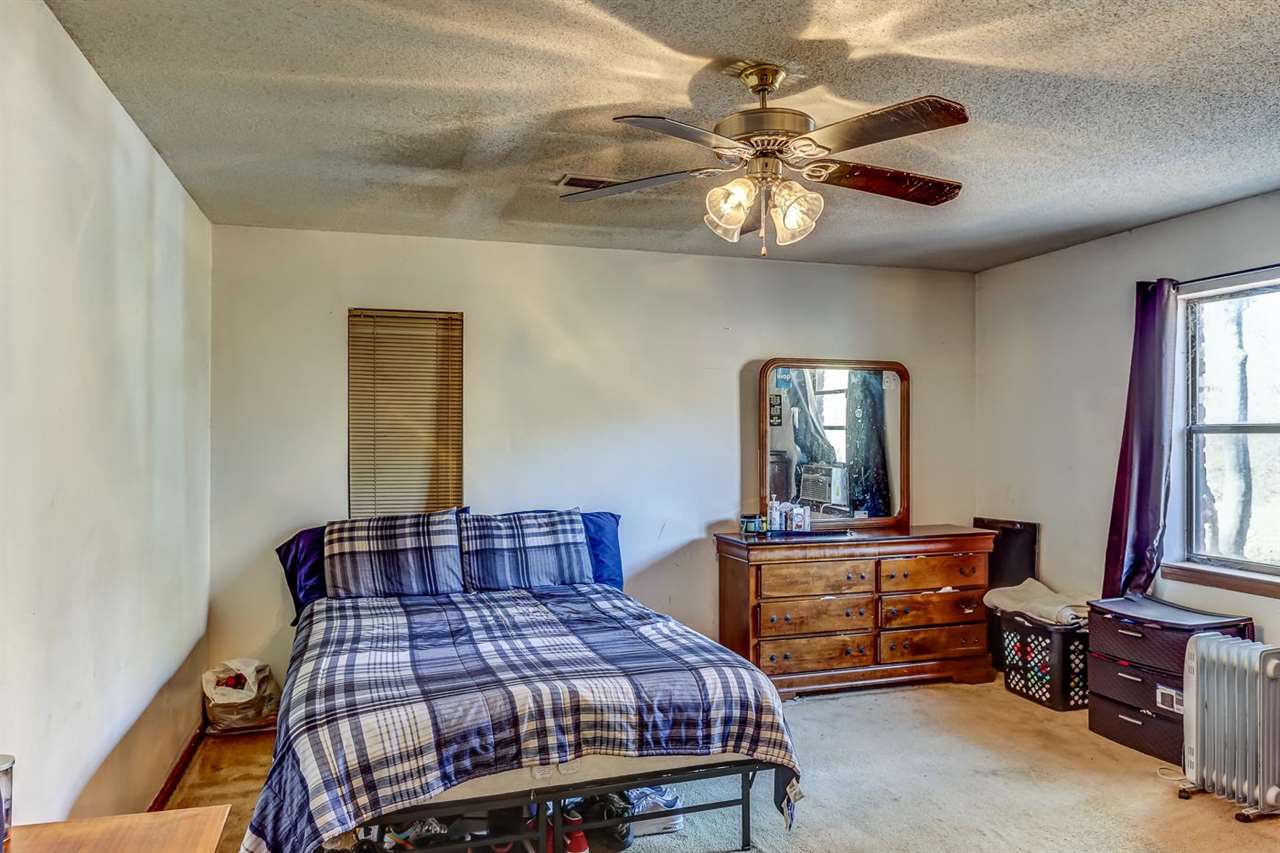 10 Windsor Road Memphis, TN 38109 - Photo 13 of 25 a bedroom with a bed and dresser with mirror