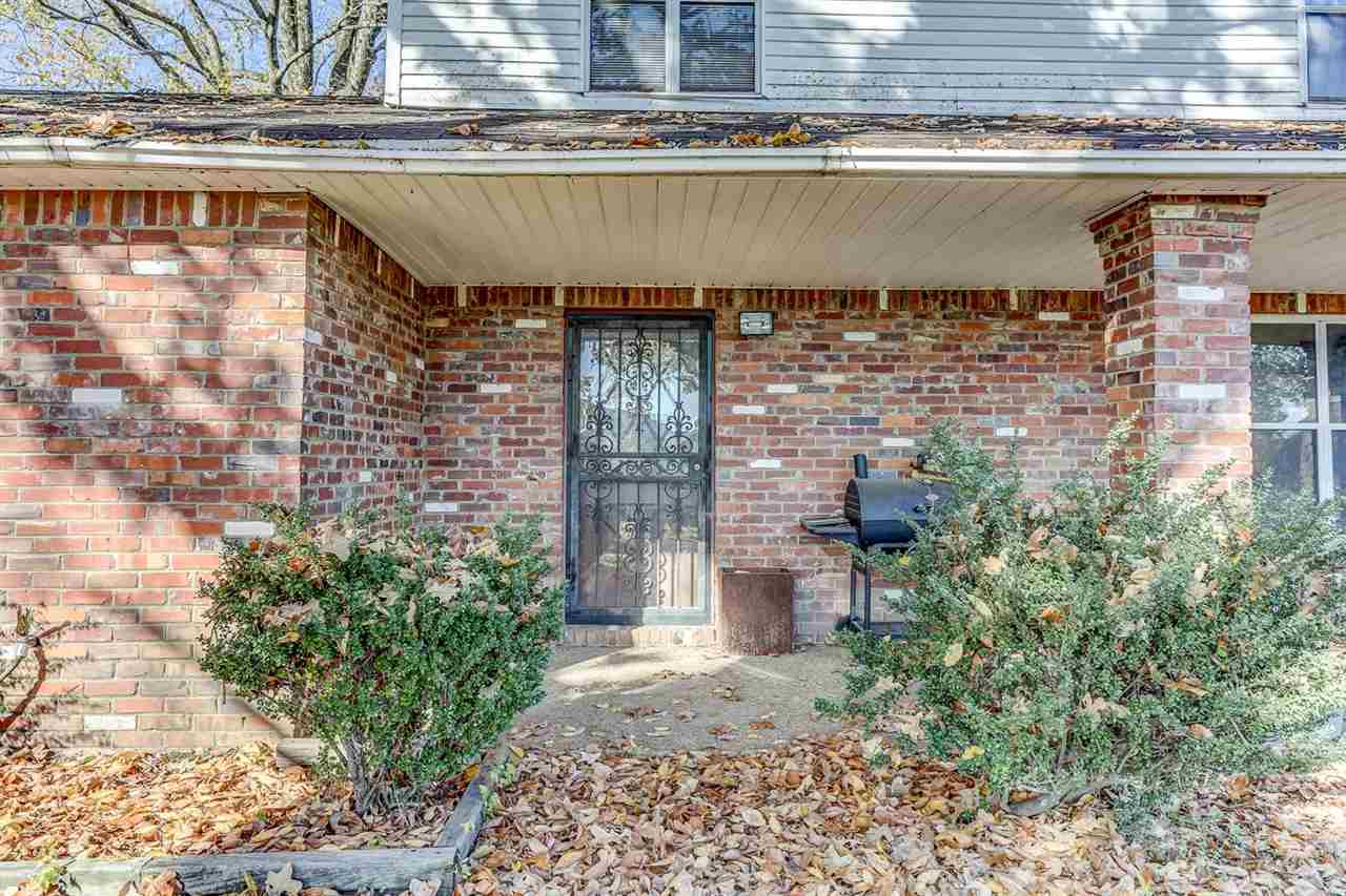 10 Windsor Road Memphis, TN 38109 - Photo 24 of 25 a couple of potted plants in front of door