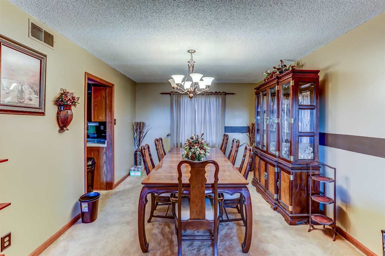 10 Windsor Road Memphis, TN 38109 - Photo 5 of 25 a view of a dining room with furniture and chandelier