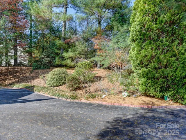 a couple of cars parked in front of a house