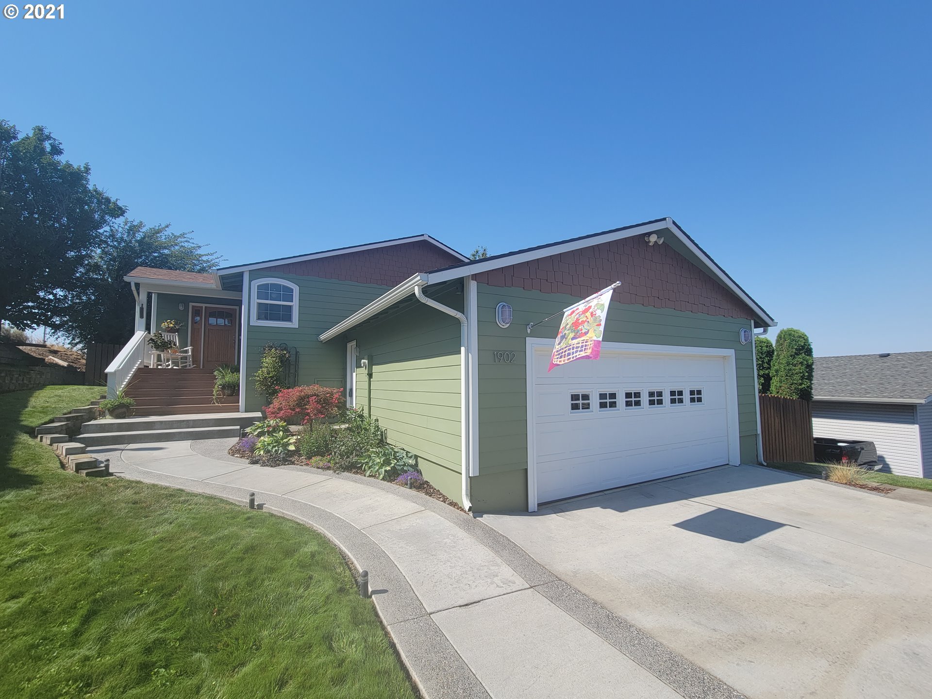 1902 Southwest Perkins Avenue Pendleton, OR 97801 - Photo 1 of 32 a front view of a house with yard garage and outdoor seating