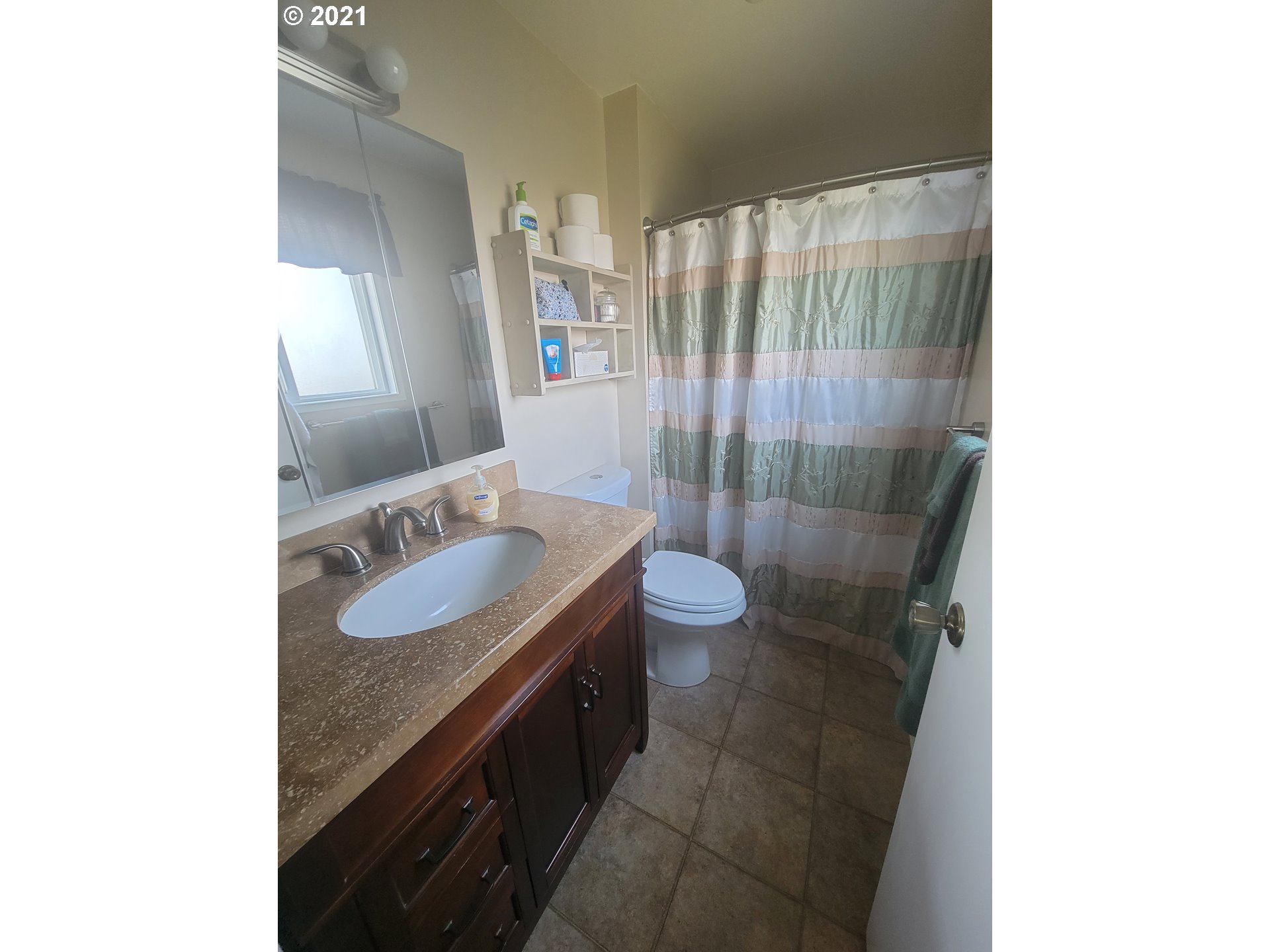1902 Southwest Perkins Avenue Pendleton, OR 97801 - Photo 17 of 32 a bathroom with a sink and a mirror