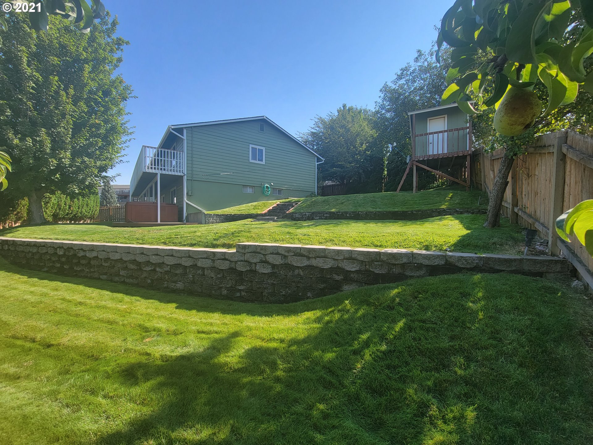 1902 Southwest Perkins Avenue Pendleton, OR 97801 - Photo 31 of 32 a view of a house with a yard and a large tree