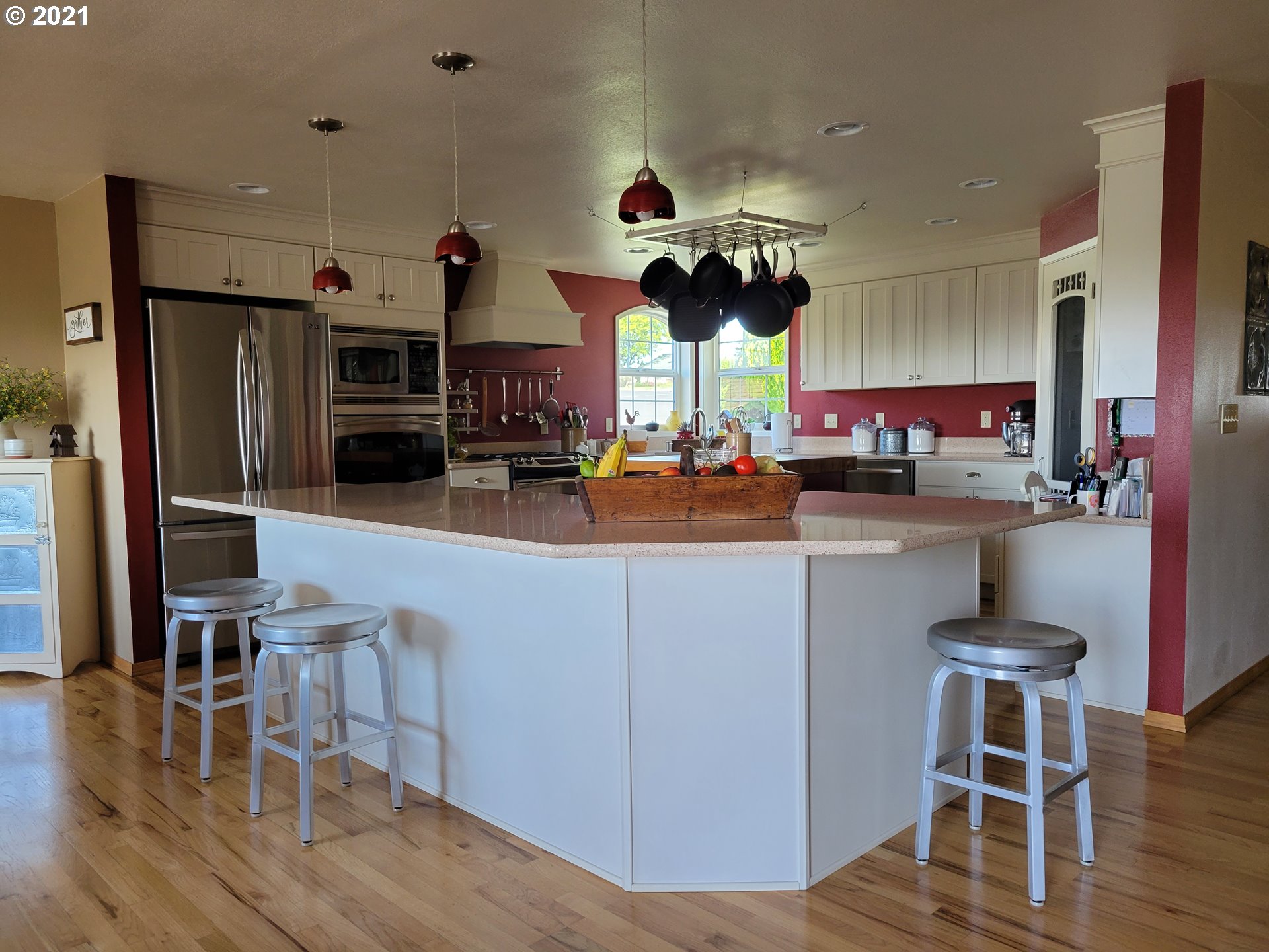 1902 Southwest Perkins Avenue Pendleton, OR 97801 - Photo 6 of 32 a kitchen with stainless steel appliances kitchen island granite countertop a table chairs and a refrigerator