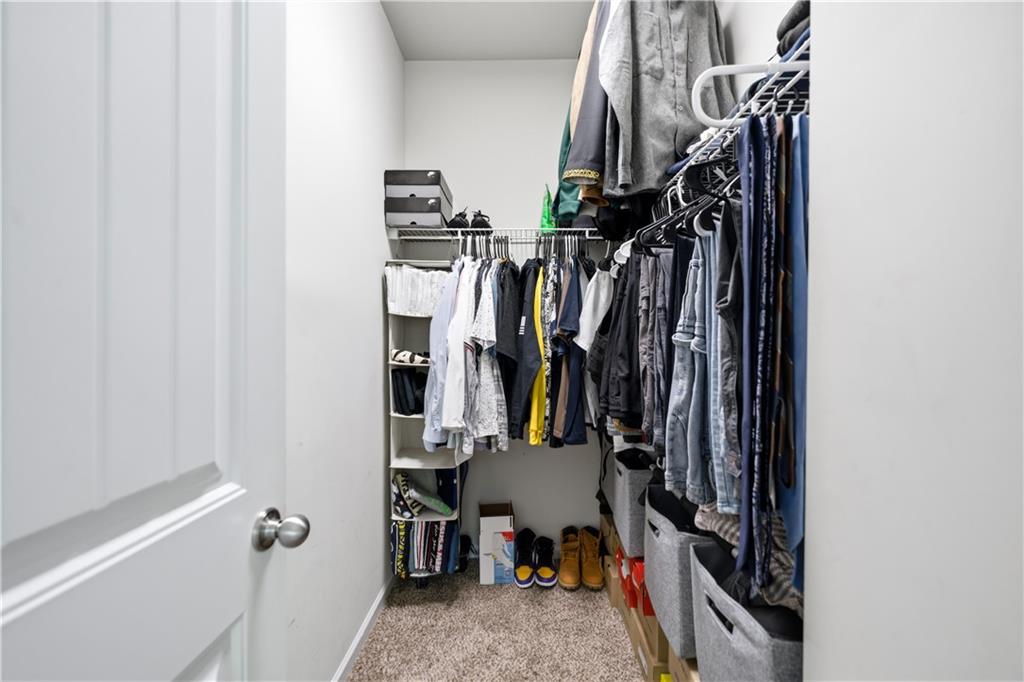 291 Boulder Run Hiram, GA 30141 - Photo 24 of 46 a view of walk in closet with clothes and shoes