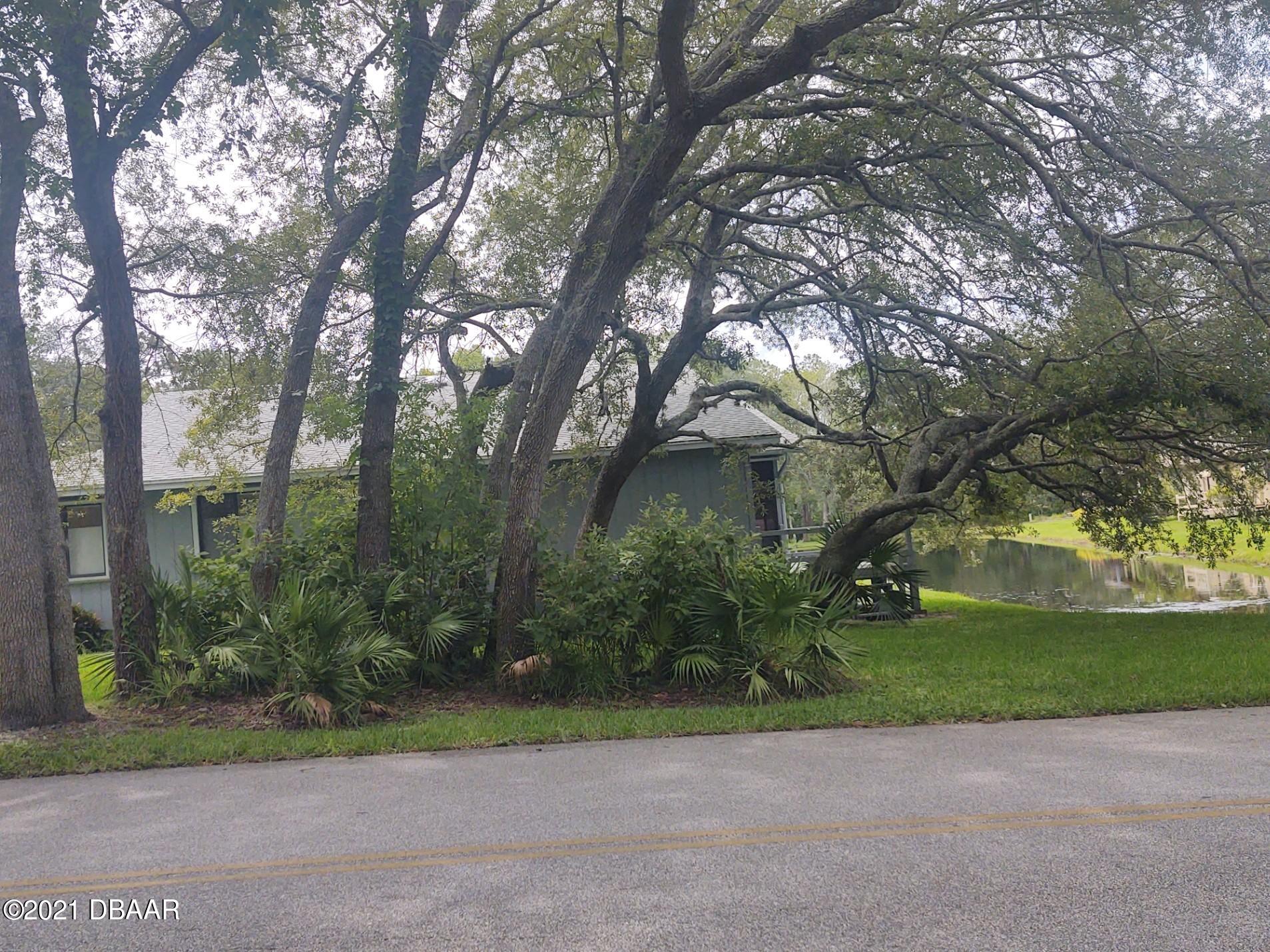 100 Rustic Pond Road Port Orange, FL 32128 - Photo 18 of 28 Side View