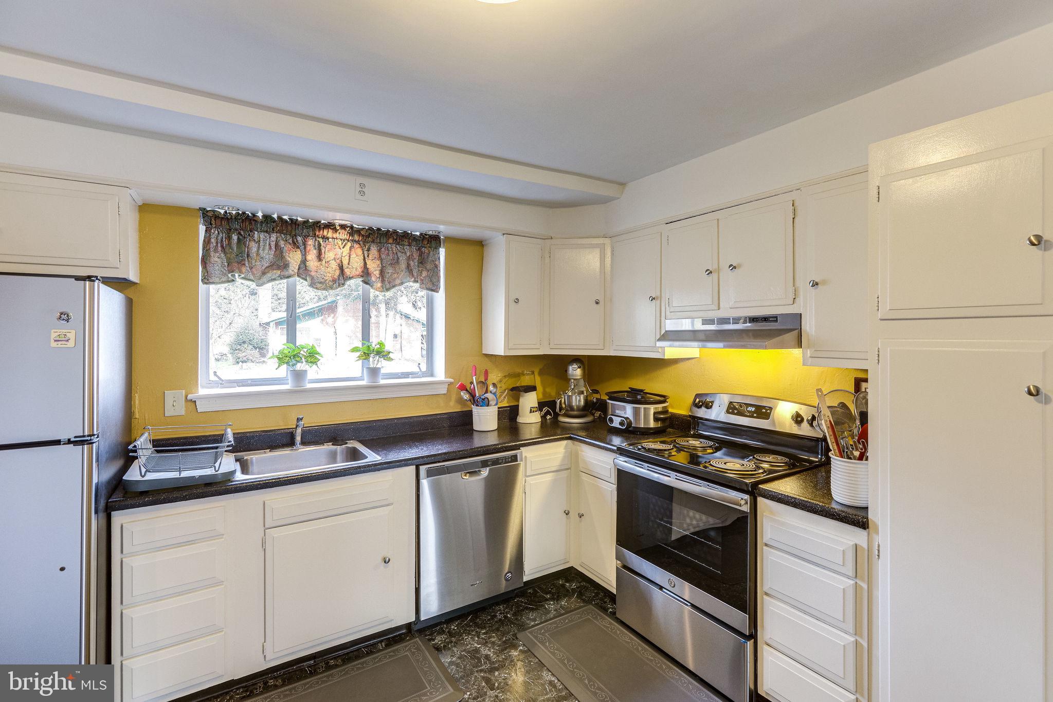 1212 Ballard Street Silver Spring, MD 20910 - Photo 23 of 41 Kitchen with stainless appliances.