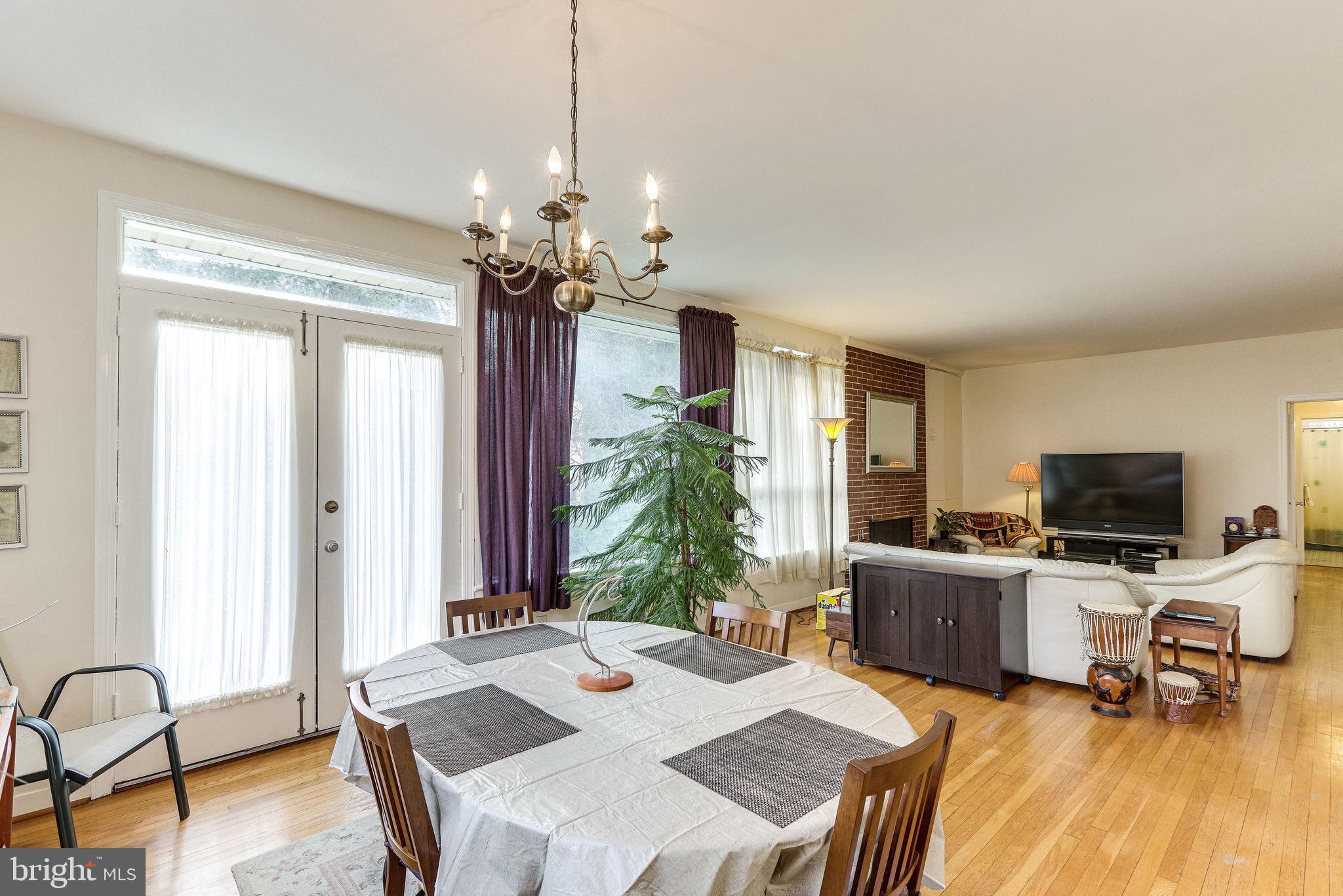 1212 Ballard Street Silver Spring, MD 20910 - Photo 10 of 41 Dining and living areas with hardwood flooring.