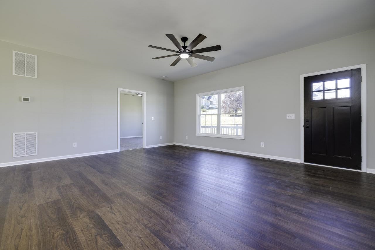 85 Springridge Lane Fairfield, VA 24435 - Photo 21 of 54 a view of an empty room with wooden floor and a window