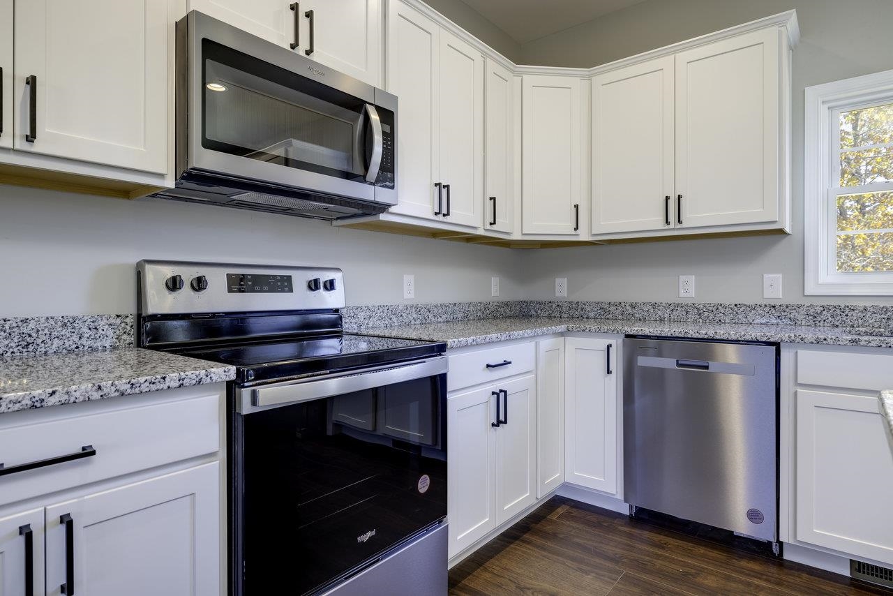 85 Springridge Lane Fairfield, VA 24435 - Photo 8 of 54 a kitchen with granite countertop cabinets stainless steel appliances and wooden floor