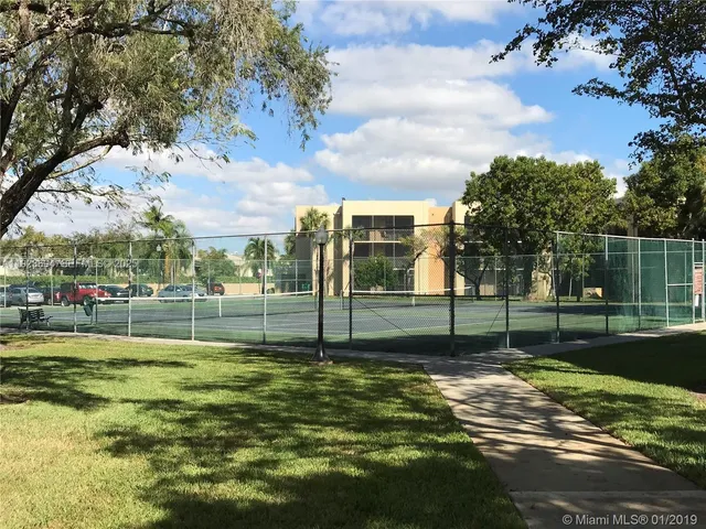a view of a swimming pool with an outdoor seating