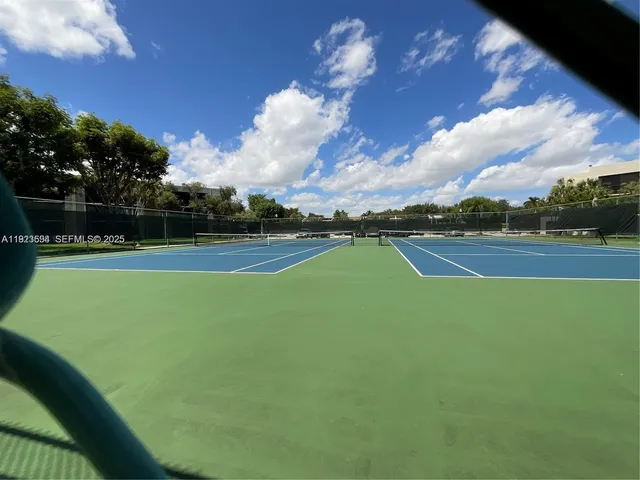 a kitchen with a table and chairs in it