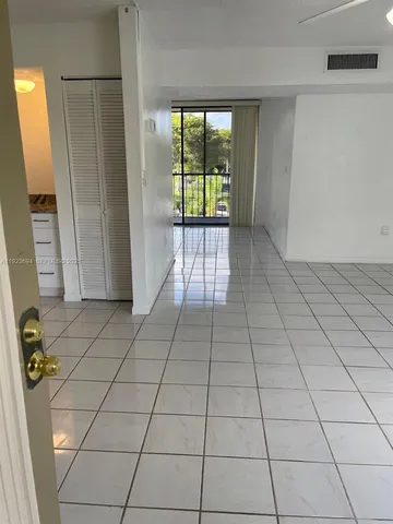 a view of an empty room and window