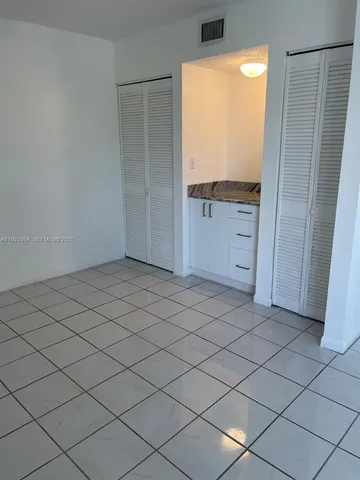 a view of a refrigerator and window