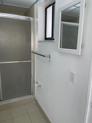 a bathroom with a mirror