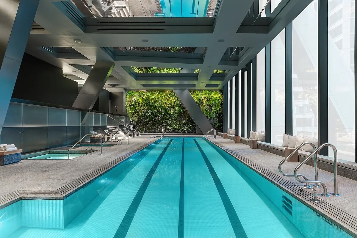 53 West 53rd Street, Unit 19E Manhattan, NY 10019 - Photo 8 of 21 a view of swimming pool with seating area