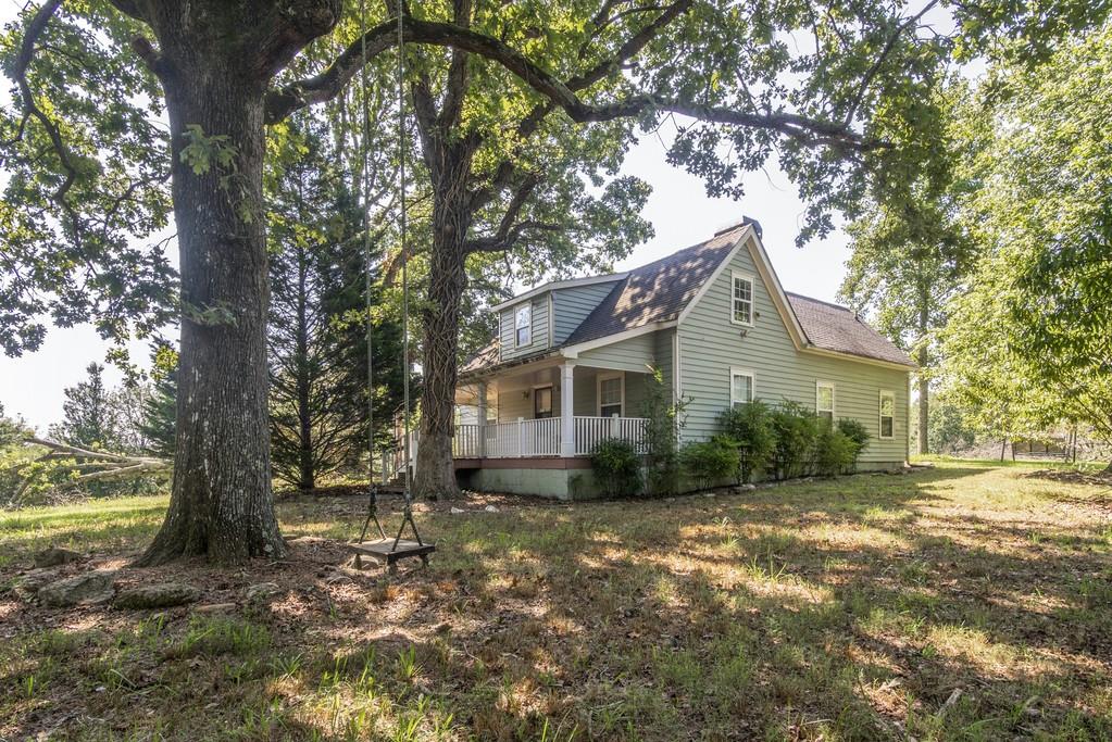 1031 Kelly Bridge Road Cumming, GA 30028 - Photo 1 of 1 Welcoming front yard featuring large tree swing!