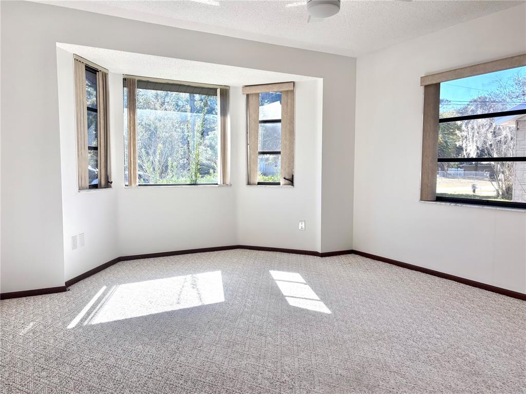 324 Alemander Avenue DeBary, FL 32713 - Photo 11 of 40 an empty room with windows