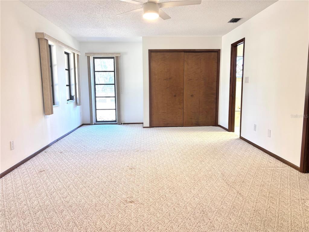 324 Alemander Avenue DeBary, FL 32713 - Photo 17 of 40 an empty room with windows and closet