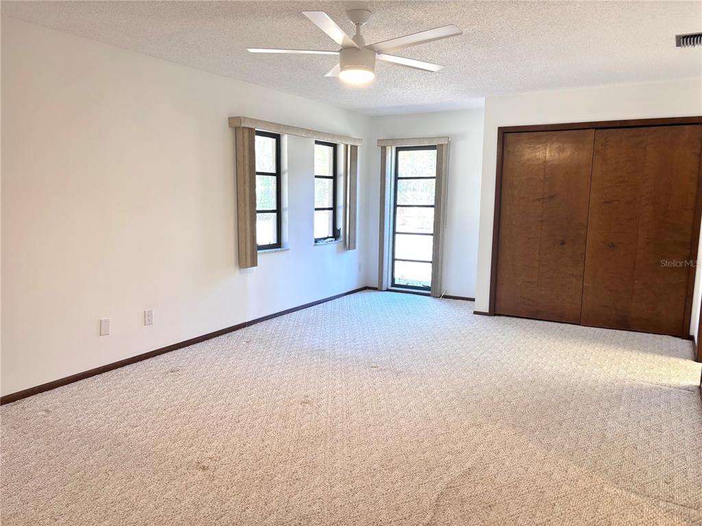 324 Alemander Avenue DeBary, FL 32713 - Photo 18 of 40 an empty room with windows and closet