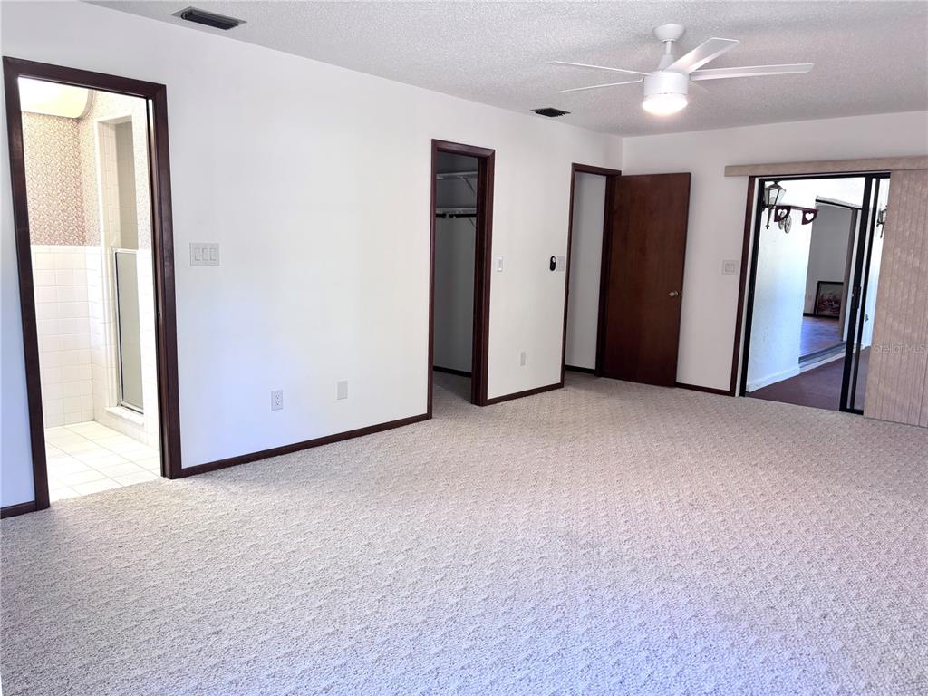324 Alemander Avenue DeBary, FL 32713 - Photo 19 of 40 an empty room with closet and windows