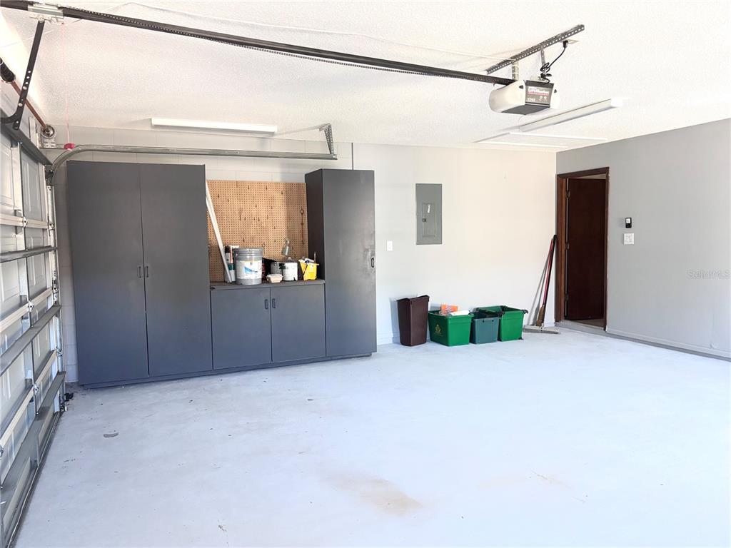 324 Alemander Avenue DeBary, FL 32713 - Photo 33 of 40 a view of a house with a garage