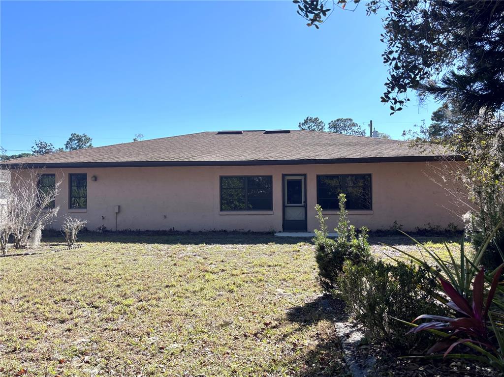 324 Alemander Avenue DeBary, FL 32713 - Photo 34 of 40 a house that has a tree in front of it