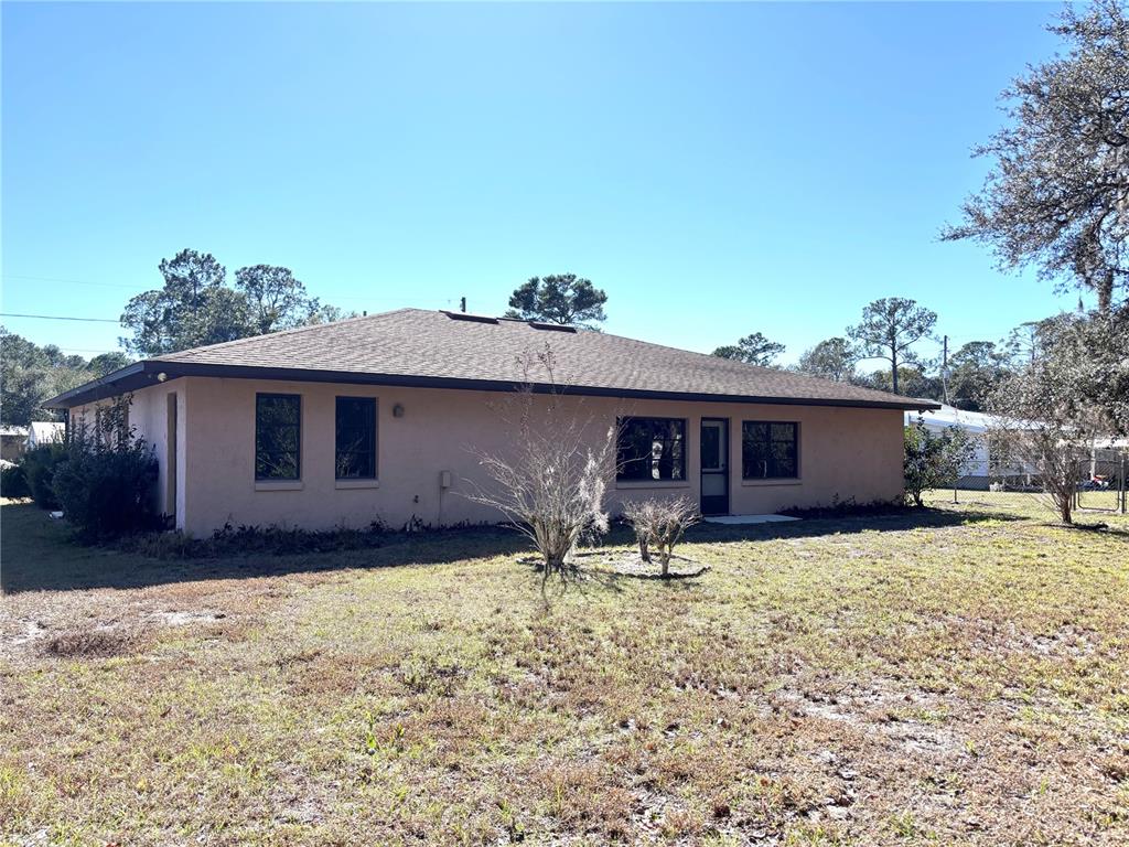 324 Alemander Avenue DeBary, FL 32713 - Photo 35 of 40 a house that has a big yard in front of it