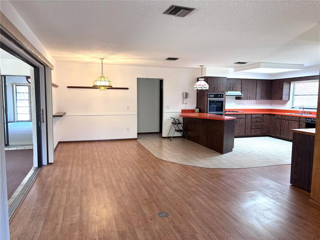 324 Alemander Avenue DeBary, FL 32713 - Photo 5 of 40 a living room with furniture and a wooden floor