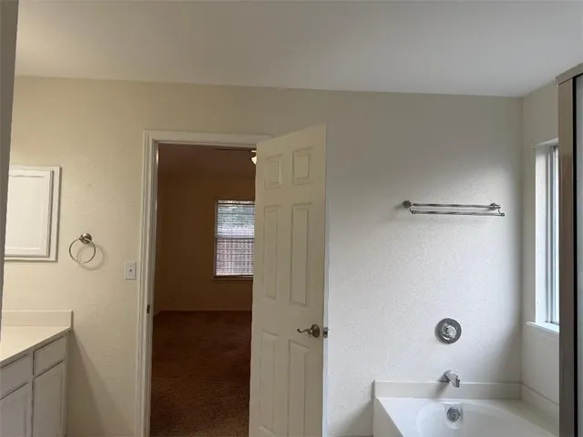 a bathroom with a sink and mirror