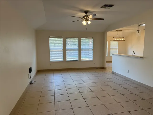 a view of a hallway with entryway chandelier and entryway