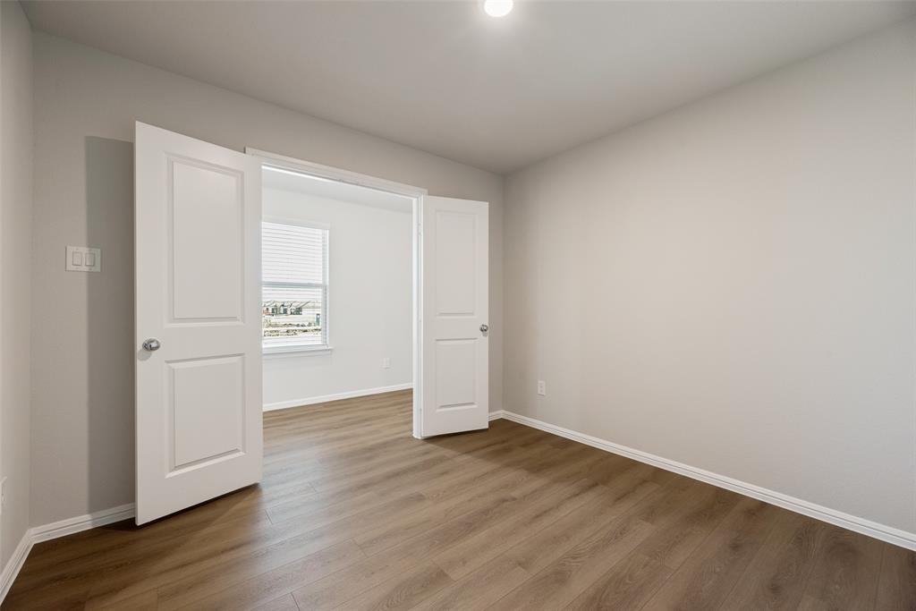 14127 Bacton Road Pilot Point, TX 76258 - Photo 11 of 18 an empty room with wooden floor