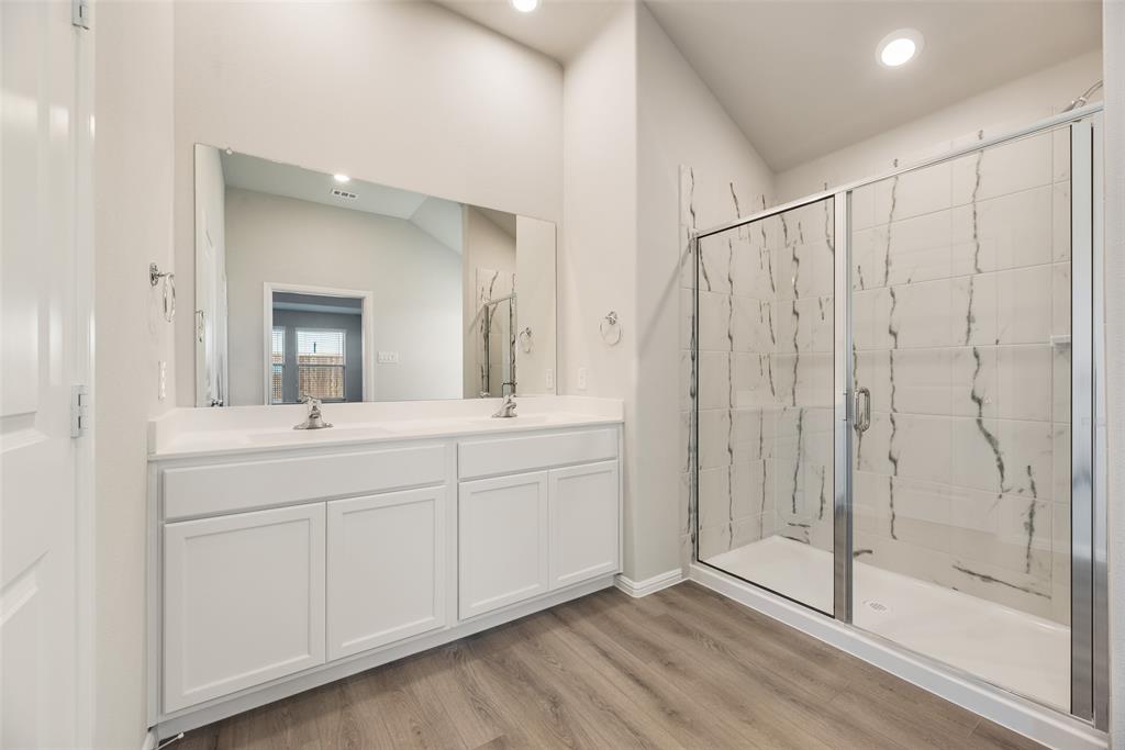 14127 Bacton Road Pilot Point, TX 76258 - Photo 7 of 18 a spacious bathroom with a shower sink and mirror