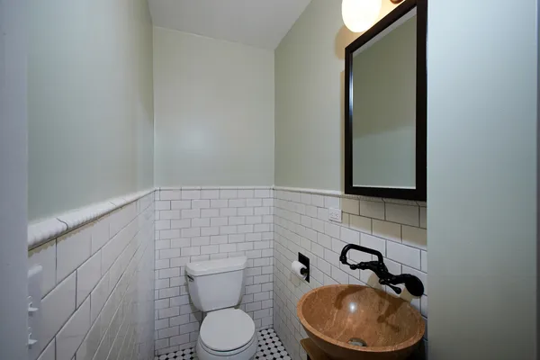 a bathroom with a toilet and a sink