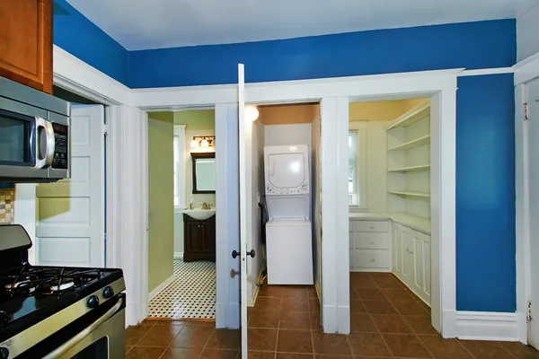 a view of a hallway and a livingroom with wooden floor